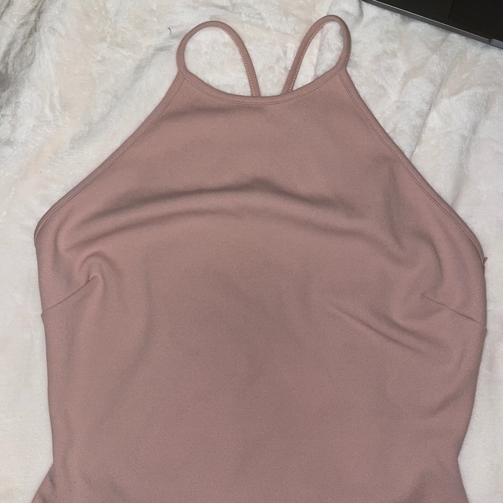 Light pink bodysuit with a lace back